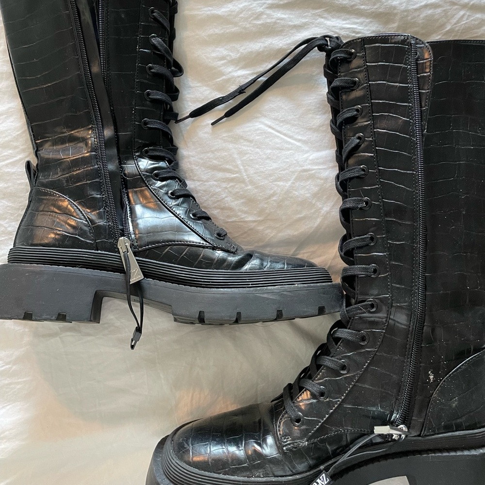 Tall black snakeskin boots